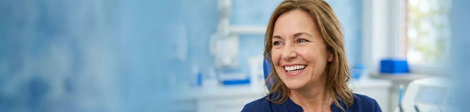 Dental crown treatment at Parkside Drive Dental in Waterloo ON Middle-aged female patient smiling with a natural-looking dental crown at Parkside Drive Dental in Waterloo, ON